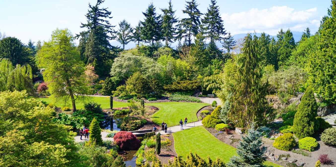 People enjoying a sunny day at Queen Elizabeth Park in Vancouver