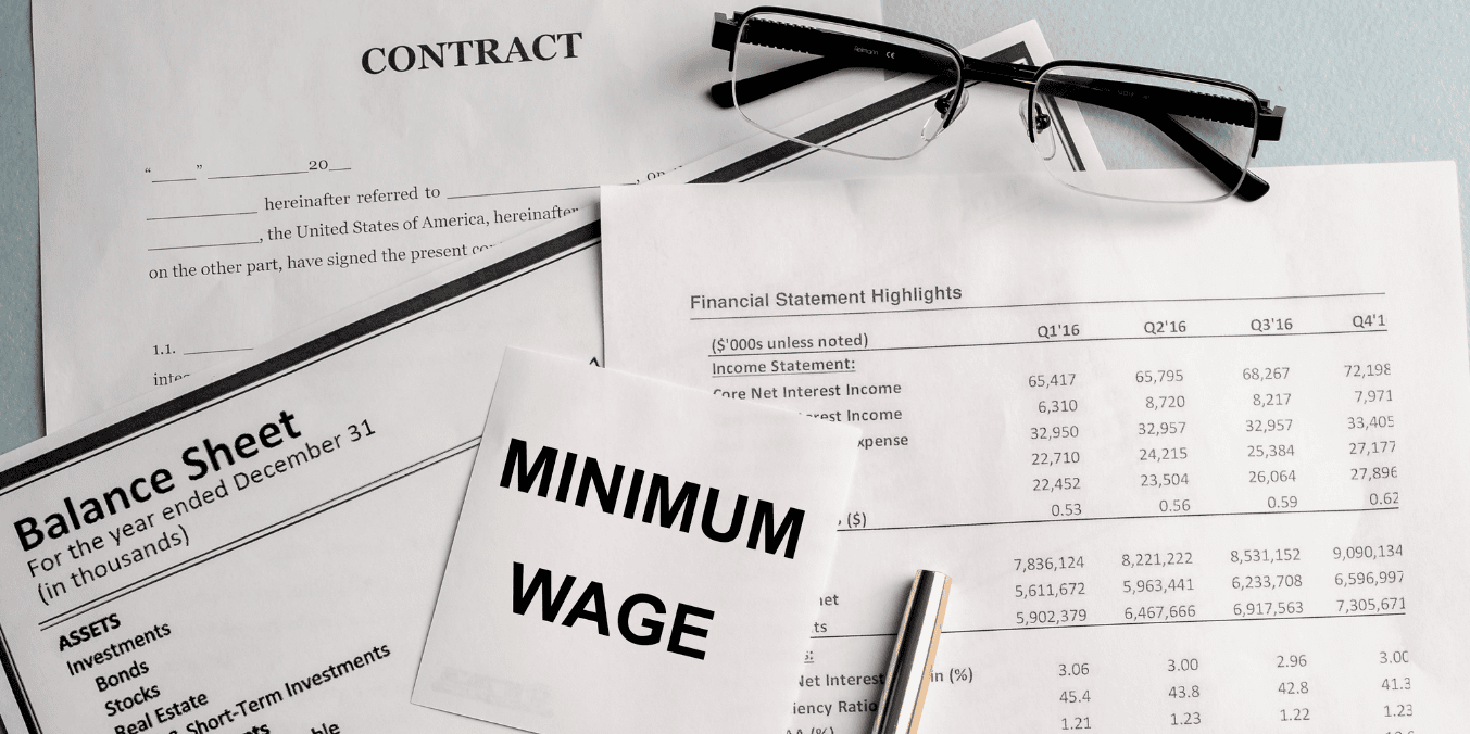 Documents and financial statements illustrating government policies and future projections for minimum wage in Vancouver.
