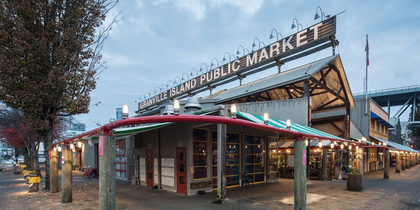 Granville Island Public Market in Vancouver, showcasing the bustling marketplace popular for its local crafts, fresh produce, and unique atmosphere.