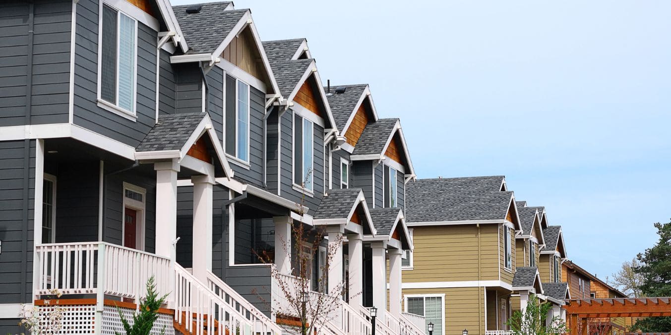 A row of houses in Vancouver representing market trends for potential renters and buyers in 2024