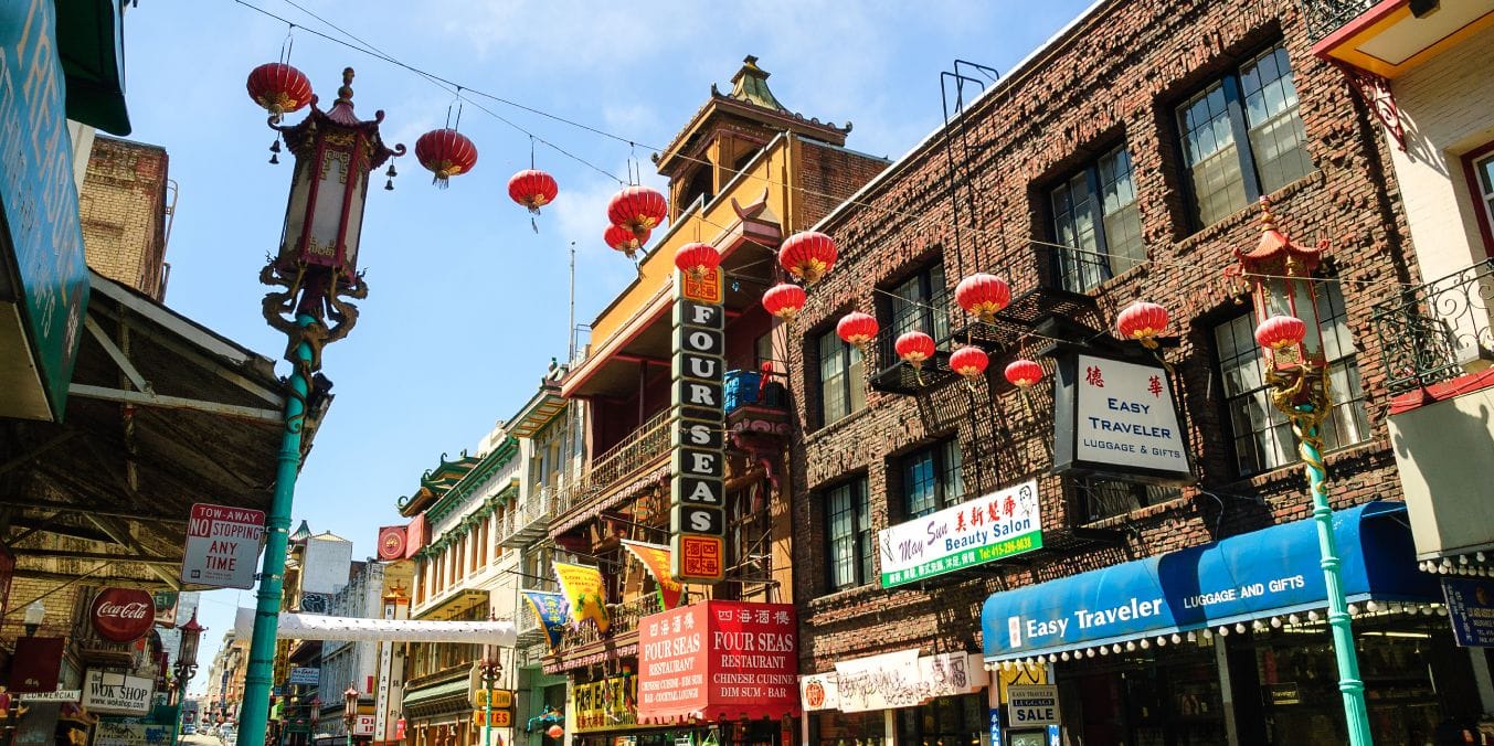 Vancouver's Chinatown street adorned with red lanterns, showcasing the cultural diversity and historic urban landscape of the city.
