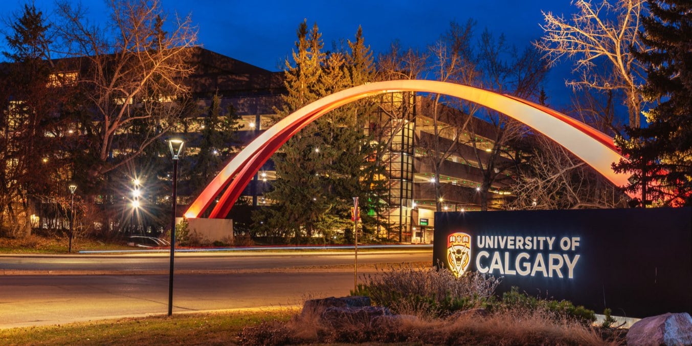 University of Calgary entrance at night, representing education and healthcare services in Calgary