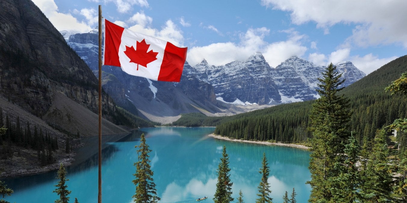 Canadian flag with Rocky Mountains and lake, representing Calgary's geography and climate differences