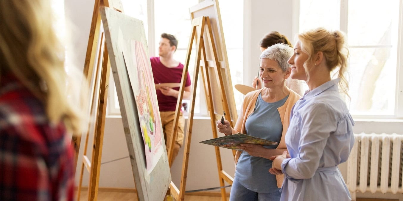 Group of people painting in an art class representing community and lifestyle in Edmonton and Calgary