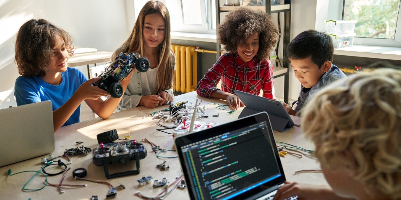 Group of students engaged in a robotics project, representing the best schools in Edmonton