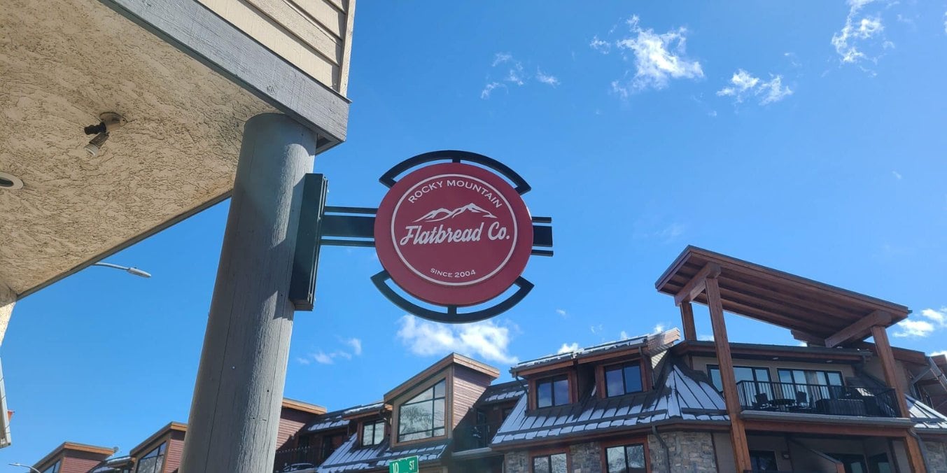 Sign for Rocky Mountain Flatbread Co, one of the best restaurants in Canmore, known for its sustainable, handcrafted dishes