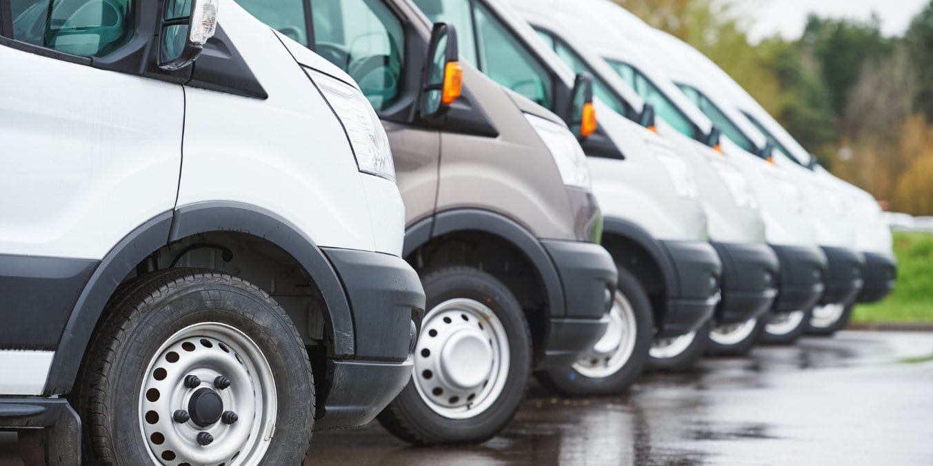 Line of parked vehicles illustrating transportation costs, including gas and car insurance, as part of the cost of living in Calgary 2024