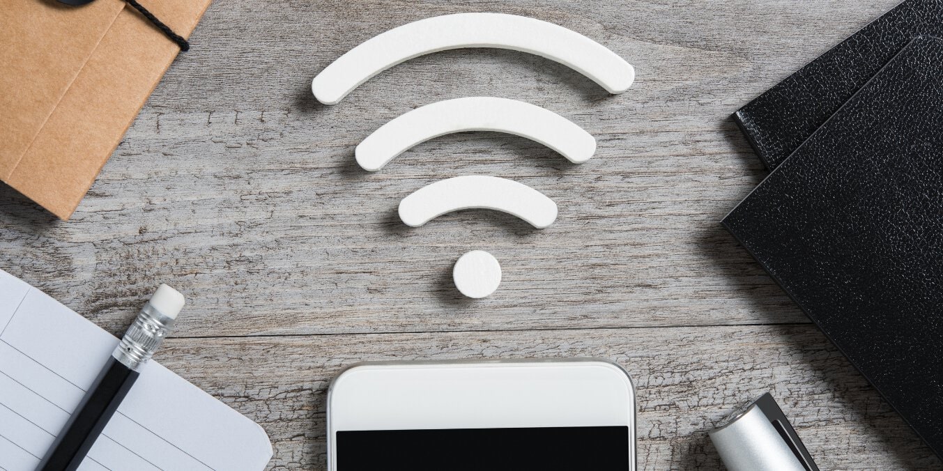 Wi-Fi symbol and smartphone representing internet costs as part of utilities in the cost of living in Calgary 2024