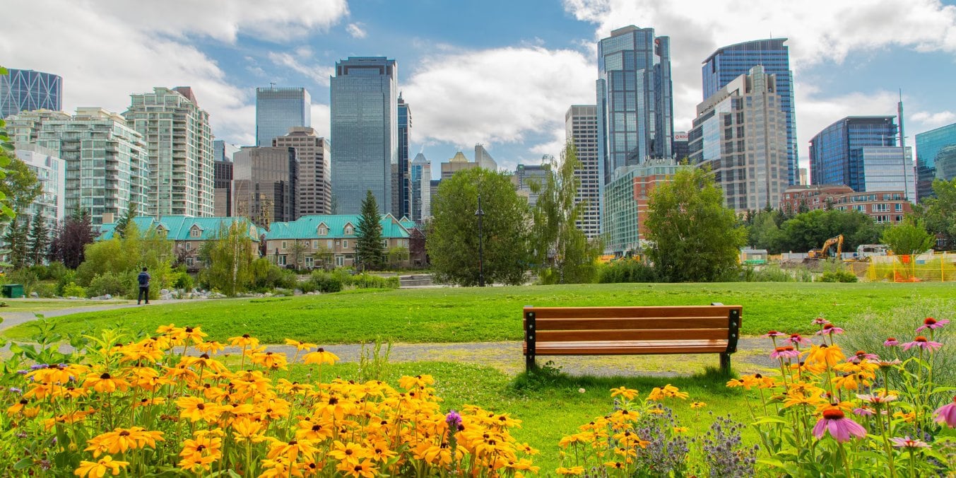 Beautiful view of Prince’s Island Park with Calgary skyline, perfect for natural fun activities in Calgary