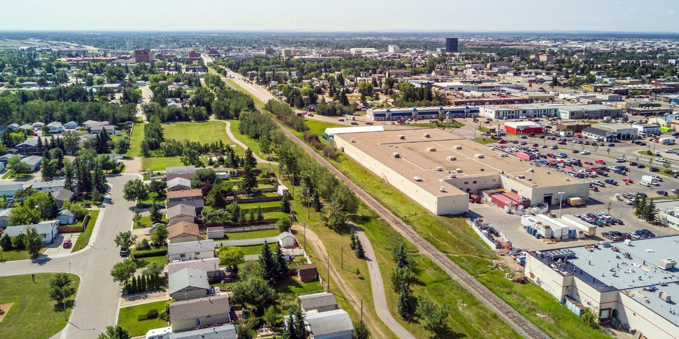 Aerial view of residential and industrial areas in Grande Prairie, showcasing why it is the best place to live in Alberta