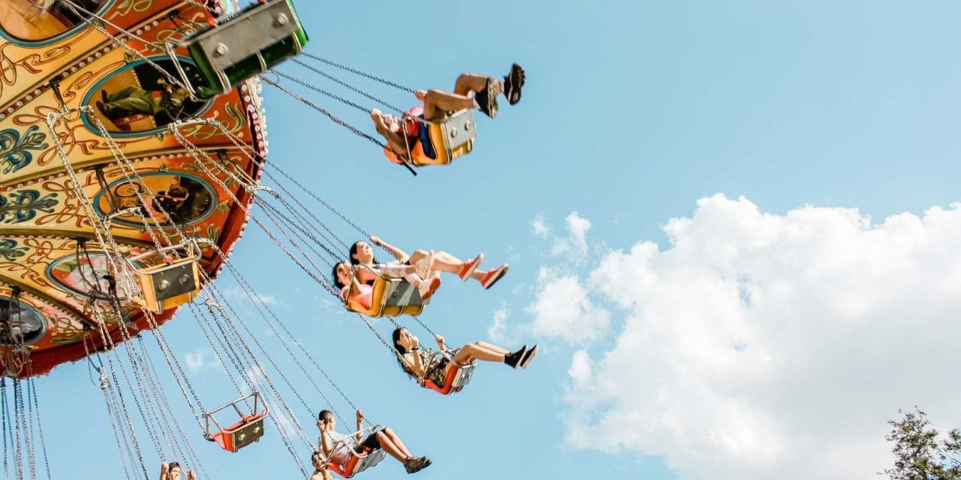 People enjoying a swing ride at Calaway Park, a popular family fun activity in Calgary