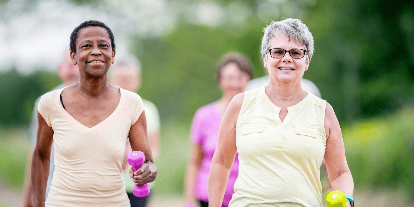 A group of active older adults exercising outdoors, symbolizing the vibrant lifestyle available to those asking, 