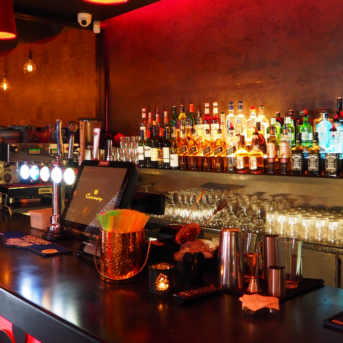 Cozy bar in Canmore offering a vibrant nightlife experience with a wide selection of drinks.