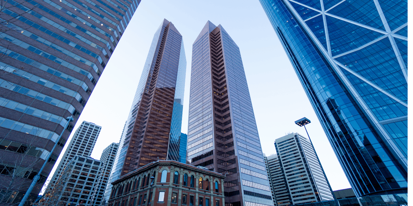 Modern skyscrapers in downtown Calgary, showcasing the city’s economic growth and opportunities, raising the question, 