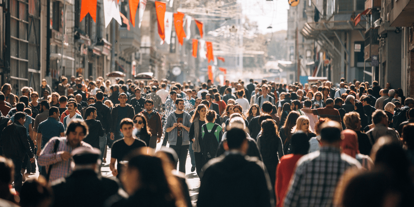 A bustling crowd in a vibrant city, showcasing the community life found in some of the safest cities in Canada.