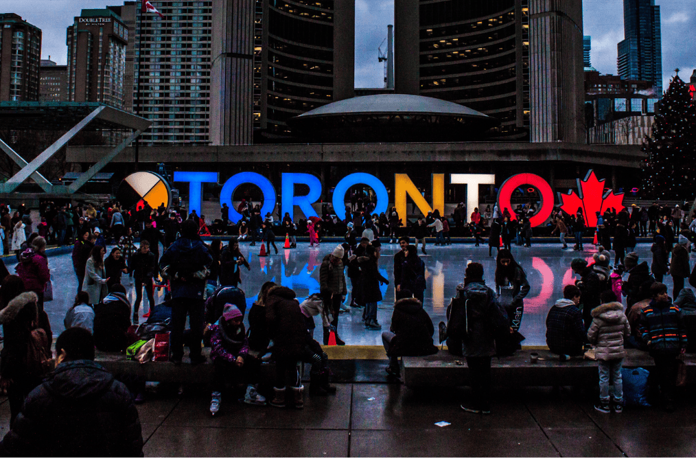 Crowds enjoying winter activities at Nathan Phillips Square in Toronto, one of the safest cities in Canada.